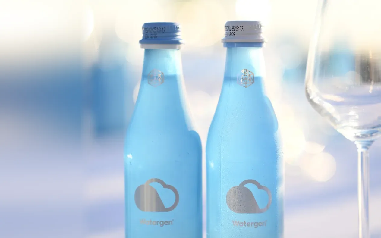 Blue Watergen glass bottles of sparkling water made from air