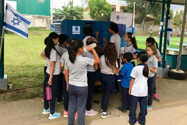 Costa Rica school students drinking from a Gen -M