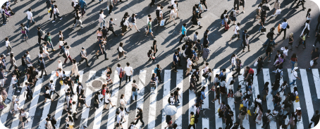 Many people crossing a road